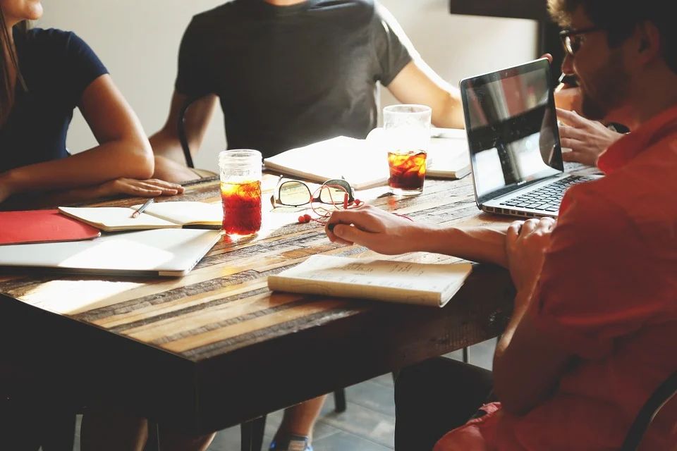 Group of writers sitting around a table